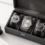 Watch Marketplace: Browse Watches From Professional Dealers Mechanical watch, research notes, and marketplace listing tiles arranged on a collector’s desk